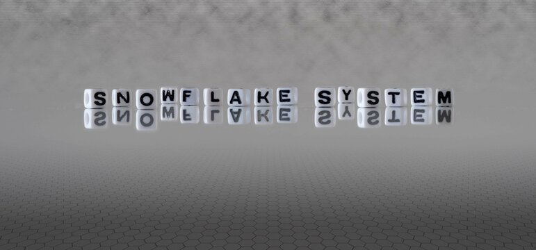 snowflake system word or concept represented by black and white letter cubes on a grey horizon background stretching to infinity