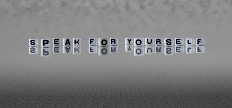 speak for yourself word or concept represented by black and white letter cubes on a grey horizon background stretching to infinity