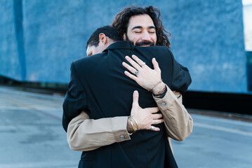 Gay Couple Hugging In The Street.