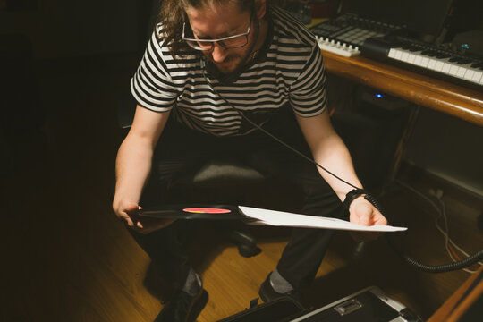focus Man holding a Vinyl Record 
