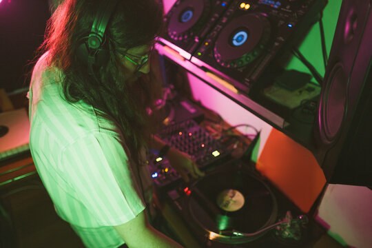 DJ Scratching vinyl record on turntable