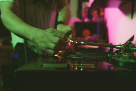 Male hands using music console