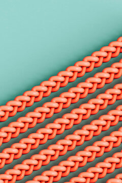 rows of pink braids on a blue background.