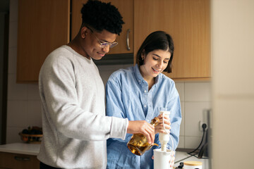 Couple cooking together at home