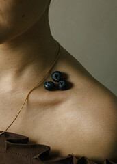 Gold necklace chain with blueberries