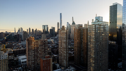 aerial view of Modern skyscrapers in megapolis of Manhattan at sunset