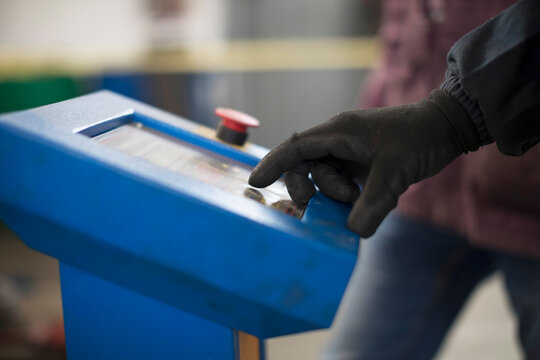 hand of a worker controlling a machinery