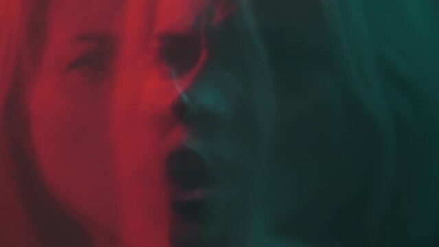 Double Exposure Woman. Psychology Health. Mental Problem. Defocused Dual Upset Stressed Female Face In Red Neon Light Dark Out Of Focus.