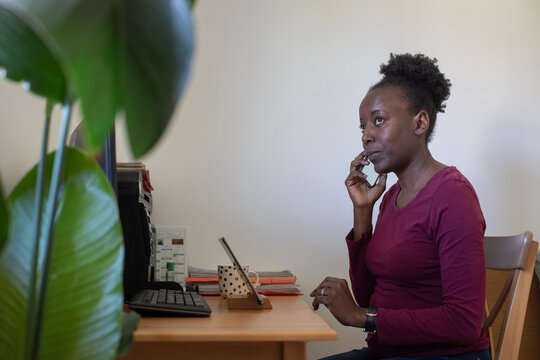 portrait of woman calling by phone at home workplace