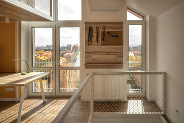 Colorful two-level children's room with net railings