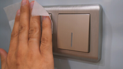 Close up cleaning and disinfection of light switches