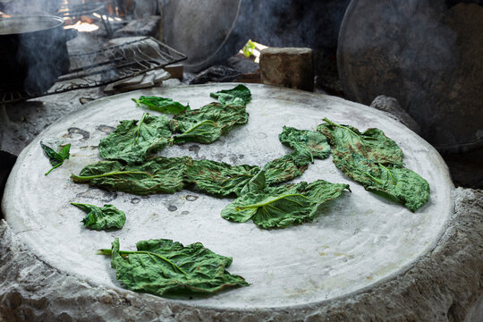 "Hoja santa" means holy leaf, roasting in a comal inside of a house