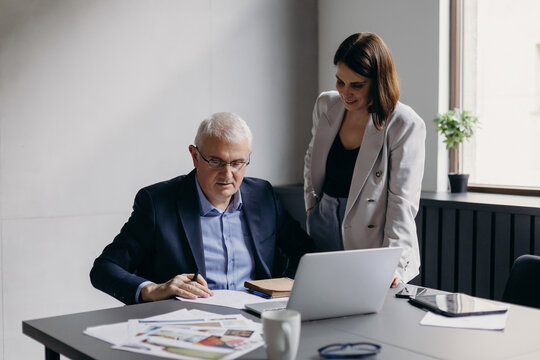 Businesspeople working with papers together