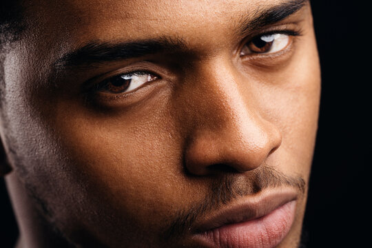 Pensive black man looking at camera