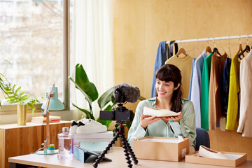 Fashion blogger showing shoe to audience