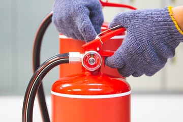 Fire extinguisher has engineer inspection checking handle of fire extinguishers to prepare fire...