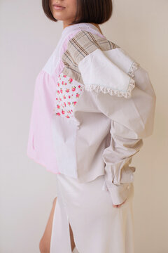 Anonymous woman in pastel colors patchwork blouse