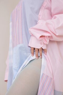 Anonymous Woman Wearing Pastel Pink Shirt 