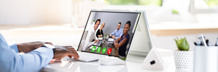Businessman Video Conferencing On Laptop In The Office