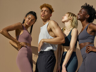 A diverse group of friends wearing sporty clothes