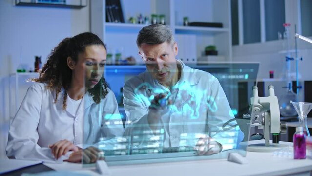 Medical scientists studying virus mutation in lab on holographic image, pandemic