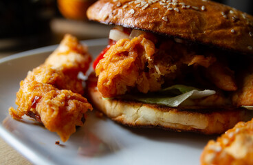 Delicious burger with crispy breaded chicken.