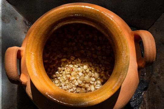Clay pot with grains of corn / Kernels inside 