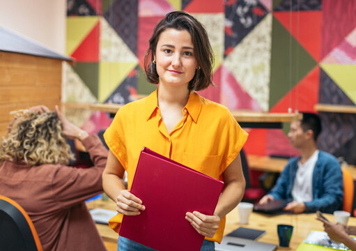 Portrait of young worker in a modern office