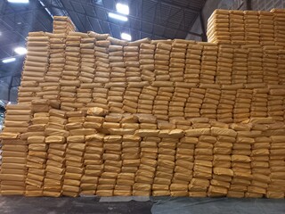 Chemical fertilizer The product stock is packed in sacks yellow , stacked in the warehouse, waiting for delivery.