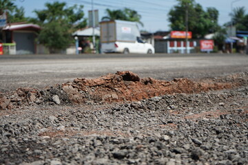 Obraz na płótnie Canvas Damaged roads are dangerous for road users.