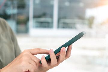 Woman hand using smartphone to do work business, social network, communication.