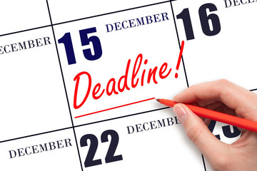 Hand drawing red line and writing the text Deadline on calendar date December 15. Deadline word...