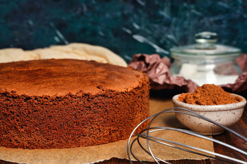 Preparing and baking a homemade chocolate sponge biscuit cake. Cooking homemade cake, copy space for text. Home confectionery. - obrazy, fototapety, plakaty