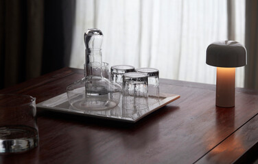 Transparent crystal cup set on wooden table

