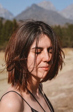 A pretty portrait of a woman in the mountains