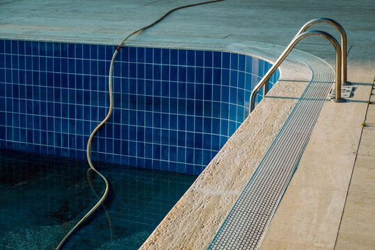Dirty empty swimming pool