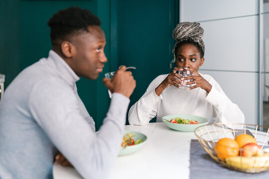 Couple drinking water during lunch