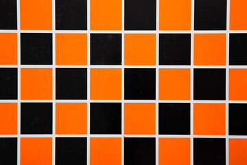 Checker board. Black and orange background