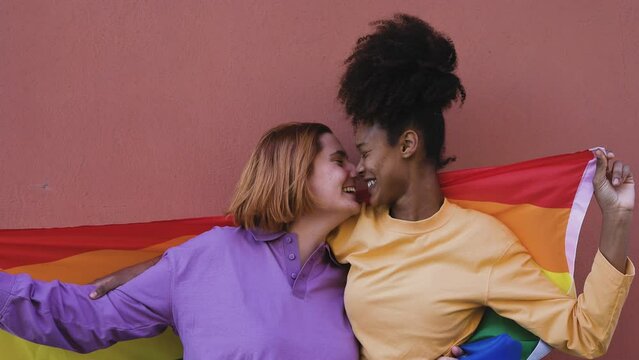 Happy gay couple celebrating pride while having romantic moment outdoor - Lgbt and love concept