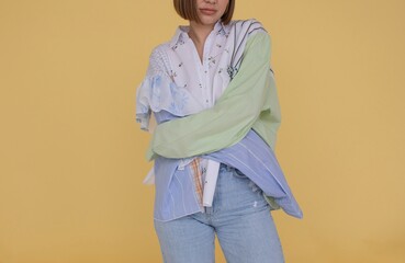 Fashion portrait of anonymous woman on yellow background