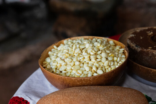 j&iacute;cara with corn kernels on one side of piloncillo