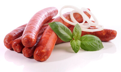 Raw Merguez Sausages with Onions isolated on white Background
