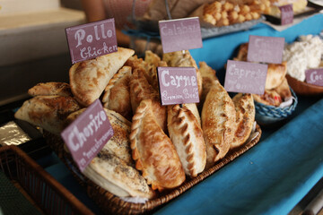 Handmade empanadas for sale at a farmer's market. 