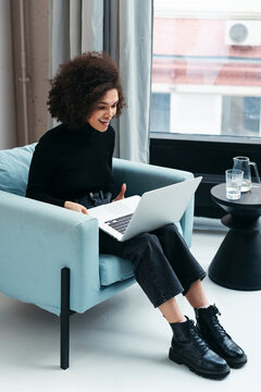 Mixed-race female video calling office from home.