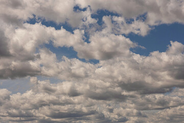 clouds in a blue sky , taken on a sunny day