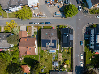 Aerial drone view of solar/photovoltaic panels on a houses roof top, Frankfurt Germany Spring