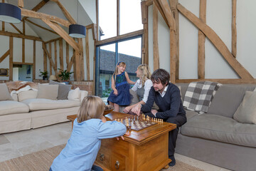 Family playing together in a luxurious family room.