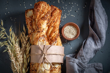 Golden bread sticks with grains and sesame seeds.