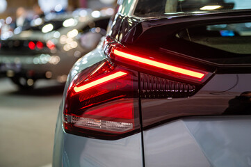 closeup of a red led taillight on a modern car, detail on the rear light of a car