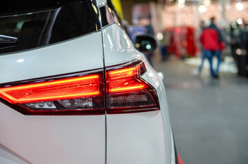 closeup of a red led taillight on a modern car, detail on the rear light of a car